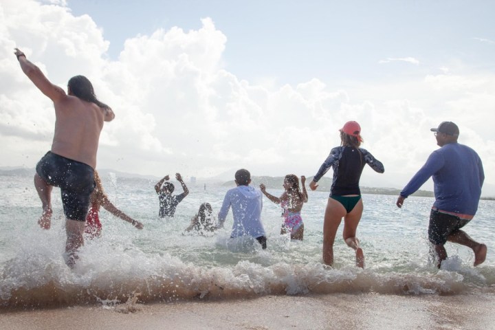 a group of people on a beach