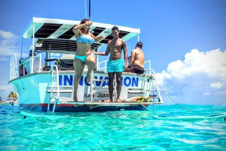 a person in a blue boat on a body of water