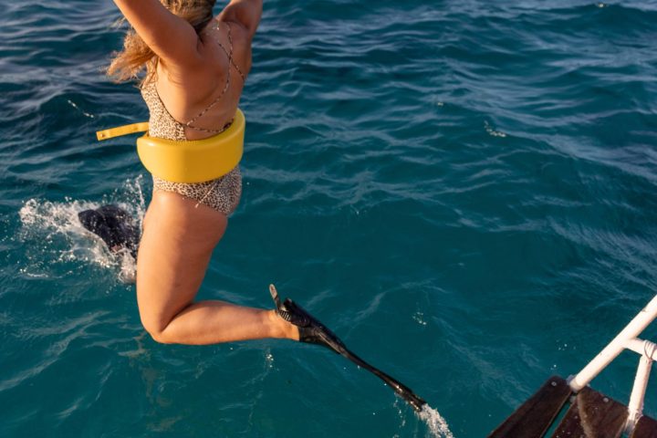 a woman swimming in the water