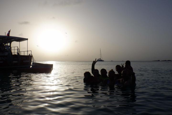 a group of people in a boat on a body of water