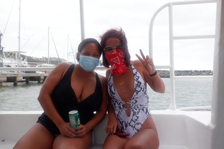 a woman sitting on a boat in the water