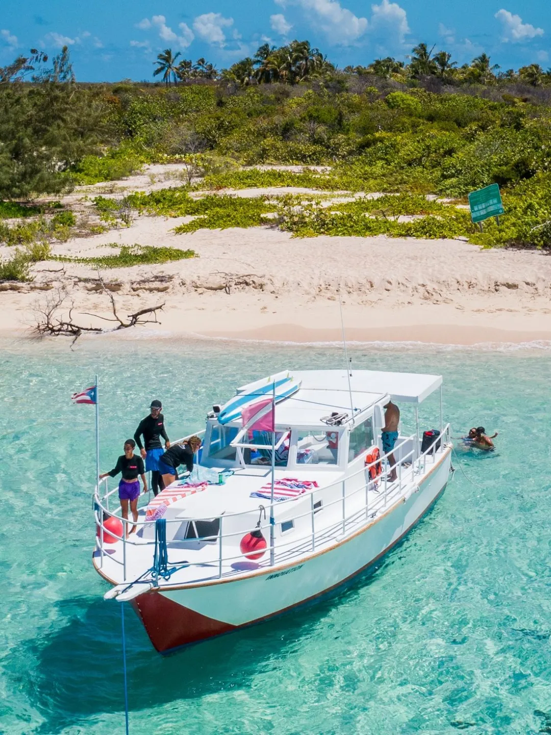 Island Hopping Charter Image 1 a small boat in a body of water