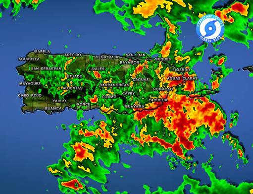 Weather radar showing heavy rain over Puerto Rico with red and orange storm areas.